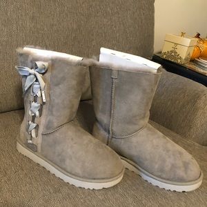Grey Ugg boots with bows on side